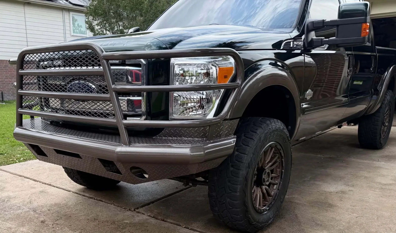 2012 Ford F-250 King Ranch on 20x9 +1mm Fuel Rebel wheels in Matte Bronze with Black Bead Ring and 35x12.50R20 Toyo Open Country R/T tires